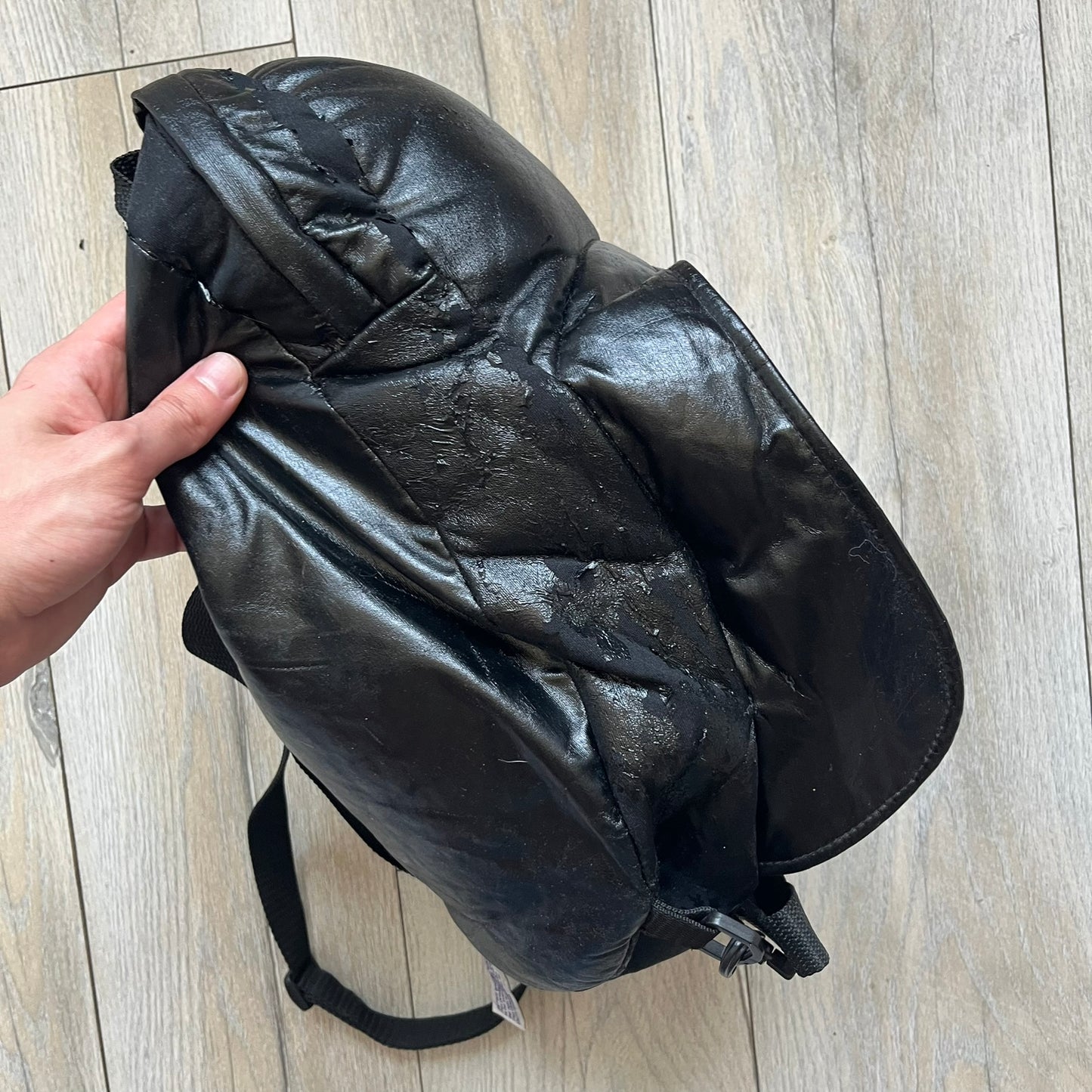 Star Wars 1990s Darth Vader Head Backpack is a vintage backpack shaped like Darth Vader’s helmet. It is finished in shiny black with molded plastic details recreating the character’s mask and helmet. The bag has one main compartment and includes a red Star Wars licensed tag from the 1990s.
