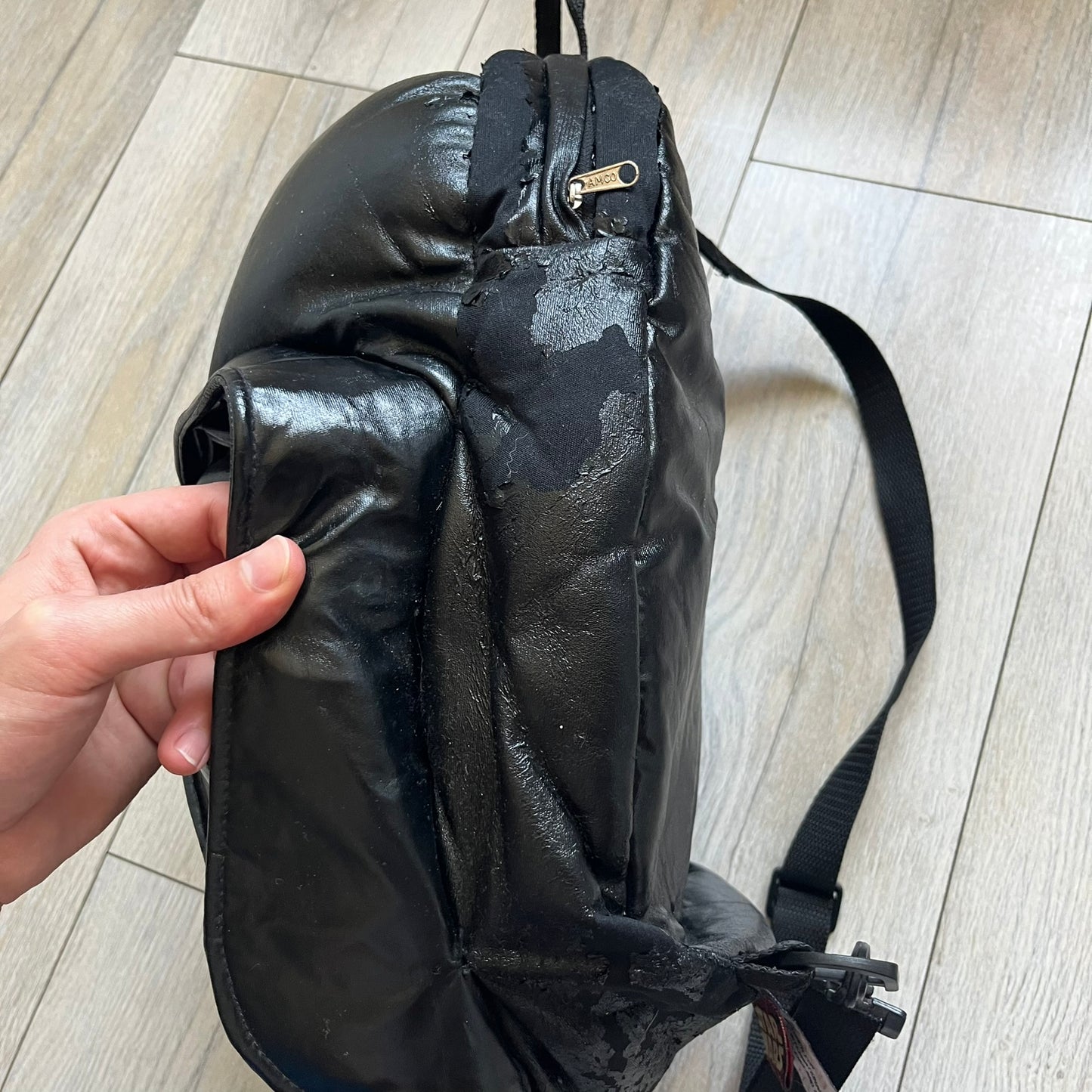 Star Wars 1990s Darth Vader Head Backpack is a vintage backpack shaped like Darth Vader’s helmet. It is finished in shiny black with molded plastic details recreating the character’s mask and helmet. The bag has one main compartment and includes a red Star Wars licensed tag from the 1990s.
