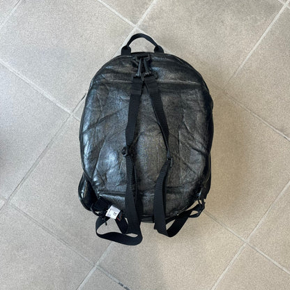 Star Wars 1990s Darth Vader Head Backpack is a vintage backpack shaped like Darth Vader’s helmet. It is finished in shiny black with molded plastic details recreating the character’s mask and helmet. The bag has one main compartment and includes a red Star Wars licensed tag from the 1990s.