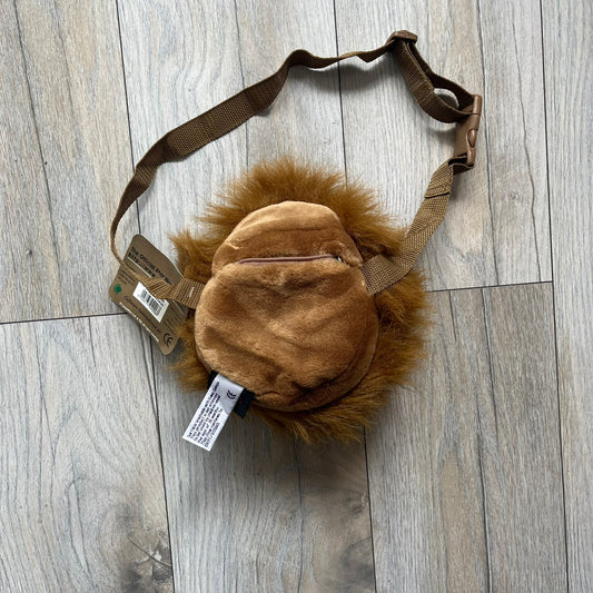 Star Wars 1990s Chewbacca Head Shoulder Bag is a novelty shoulder bag designed in the shape of Chewbacca’s head. The exterior features a furry construction with plastic eyes and a leather-like nose and mouth. It includes an adjustable shoulder strap, a single main compartment, a red Star Wars licensed tag, and the original paper tag.