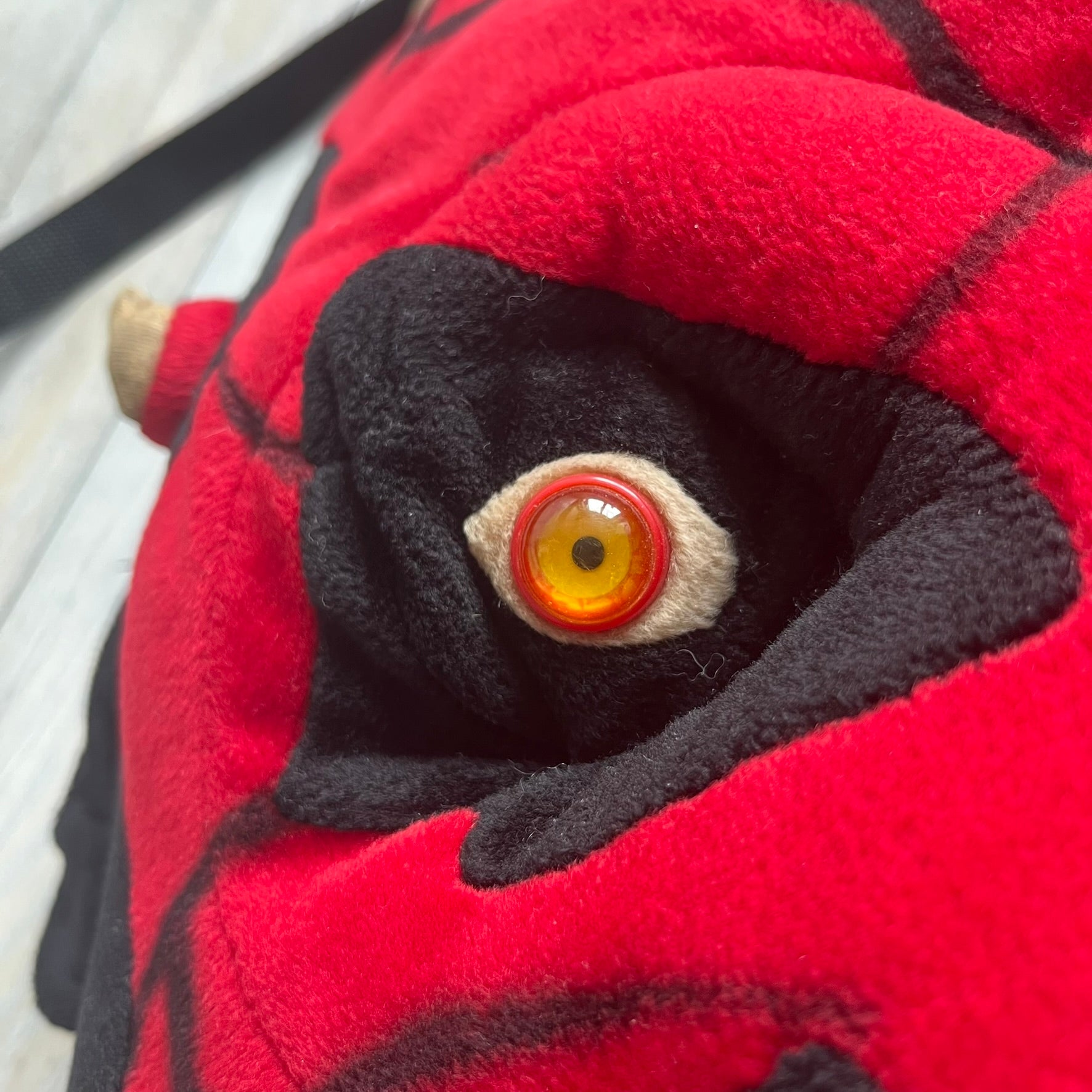 Star Wars 90's Darth Maul Head Backpack is a plush backpack shaped like Darth Maul’s head with striking red-and-black detailing and realistic plastic eyes. Features a small zip compartment on the back and adjustable straps, perfect as a collectible or standout accessory.