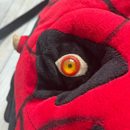Star Wars 90's Darth Maul Head Backpack is a plush backpack shaped like Darth Maul’s head with striking red-and-black detailing and realistic plastic eyes. Features a small zip compartment on the back and adjustable straps, perfect as a collectible or standout accessory.