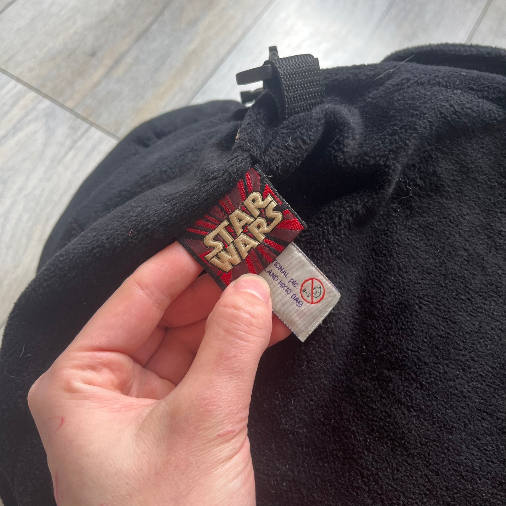 Star Wars 90's Darth Maul Head Backpack is a plush backpack shaped like Darth Maul’s head with striking red-and-black detailing and realistic plastic eyes. Features a small zip compartment on the back and adjustable straps, perfect as a collectible or standout accessory.
