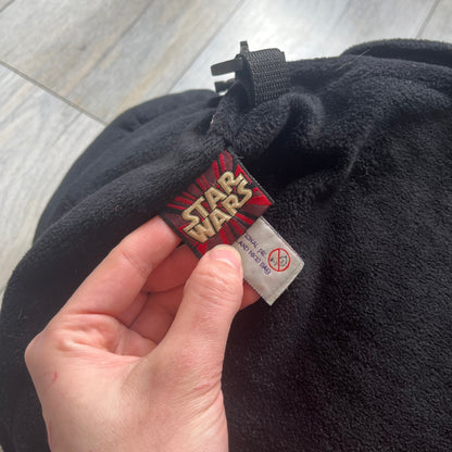Star Wars 90's Darth Maul Head Backpack is a plush backpack shaped like Darth Maul’s head with striking red-and-black detailing and realistic plastic eyes. Features a small zip compartment on the back and adjustable straps, perfect as a collectible or standout accessory.