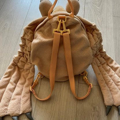 Vintage 1990s Star Wars backpack shaped like Jar Jar Binks’ head, complete with oversized ears for a playful, collectible design. This nostalgic piece captures the quirky charm of the character while offering functional storage. A rare, fun accessory for fans of classic Star Wars memorabilia.