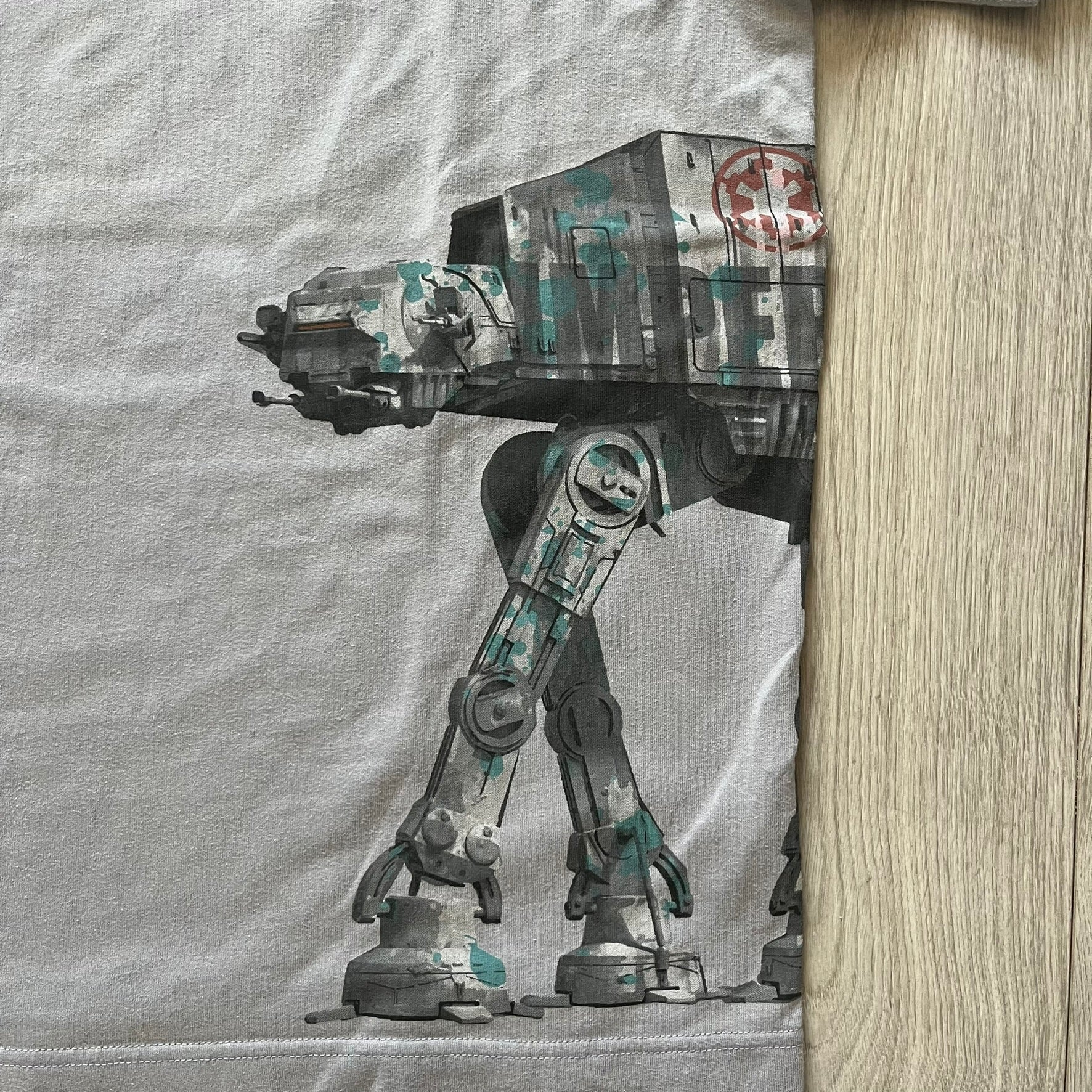 T-shirt with a robot design on a wooden surface