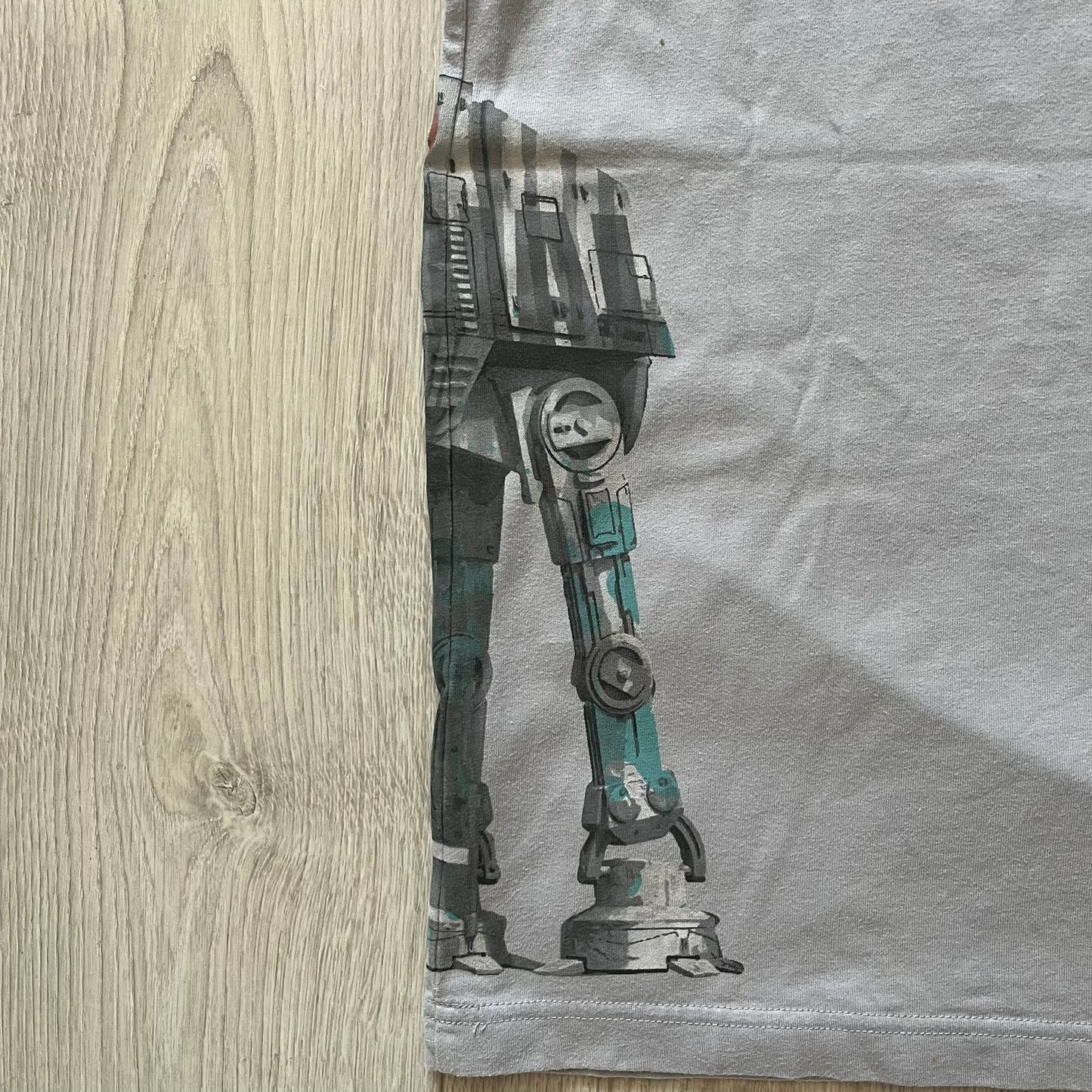 Mechanical leg design on a gray fabric background