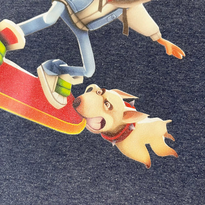 Subway Surfers 2010s Jake Tee is a grey T-shirt made on a Fruit of the Loom blank. The front features Jake, the main character from Subway Surfers, riding his skateboard, with the pursuing guard dog biting the end of the board. The design is printed in full color on the front.
