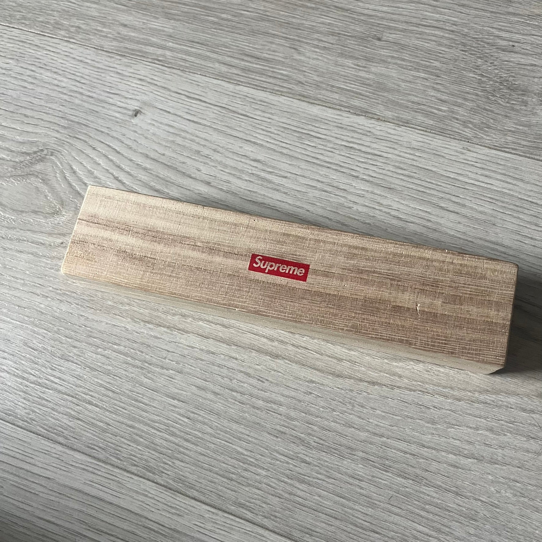The Supreme CDW Push Pin FW24 Set, released in Week 10 (October 2024), offers eight brass-made pins with detailed debossed graphics including the classic Box Logo and “Fuck Em!” motif. Produced in Japan, this set turns simple desk essentials into collectible Supreme artifacts.