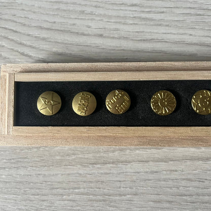 The Supreme CDW Push Pin FW24 Set, released in Week 10 (October 2024), offers eight brass-made pins with detailed debossed graphics including the classic Box Logo and “Fuck Em!” motif. Produced in Japan, this set turns simple desk essentials into collectible Supreme artifacts.