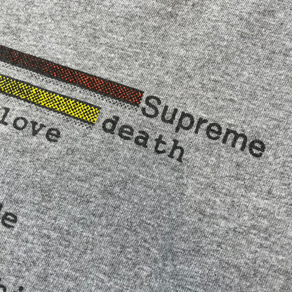 Supreme Chart SS18 Gray Tee released on February 15, 2018, as part of the Spring/Summer 2018 collection. Made from 90% cotton and 10% polyester, it features a multicolored horizontal bar graph on the front ranking “Supreme” above various themes like death, love, and money.