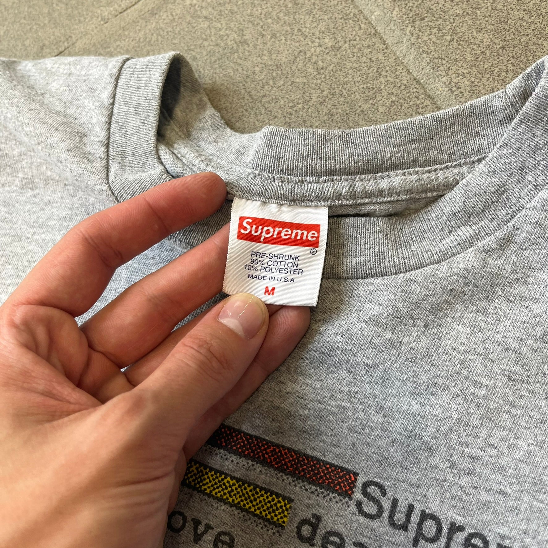 Supreme Chart SS18 Gray Tee released on February 15, 2018, as part of the Spring/Summer 2018 collection. Made from 90% cotton and 10% polyester, it features a multicolored horizontal bar graph on the front ranking “Supreme” above various themes like death, love, and money.