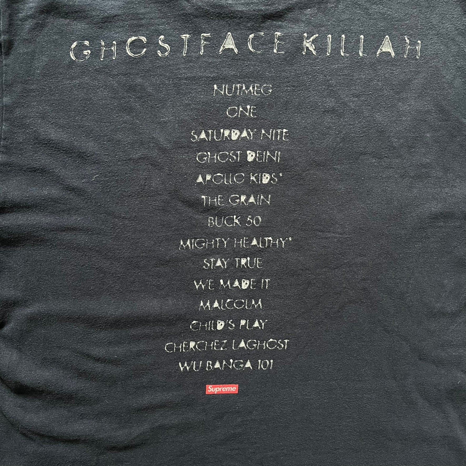 Supreme Clientele FW20 Navy Tee released in October 2020 as part of Supreme’s Fall/Winter 2020 collection. This cotton tee pays tribute to Ghostface Killah’s 2000 album Supreme Clientele, featuring the album’s iconic title graphic on the front and full tracklist on the back. A standout Supreme graphic tee that merges streetwear with hip-hop history.