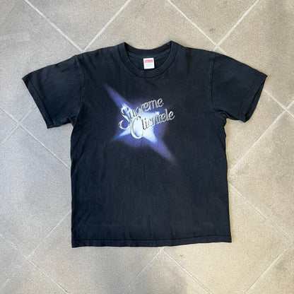 Supreme Clientele FW20 Navy Tee released in October 2020 as part of Supreme’s Fall/Winter 2020 collection. This cotton tee pays tribute to Ghostface Killah’s 2000 album Supreme Clientele, featuring the album’s iconic title graphic on the front and full tracklist on the back.