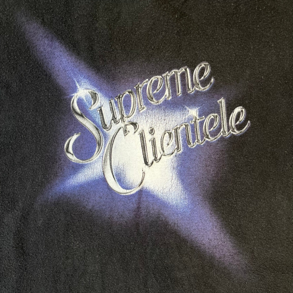 Supreme Clientele FW20 Navy Tee released in October 2020 as part of Supreme’s Fall/Winter 2020 collection. This cotton tee pays tribute to Ghostface Killah’s 2000 album Supreme Clientele, featuring the album’s iconic title graphic on the front and full tracklist on the back.
