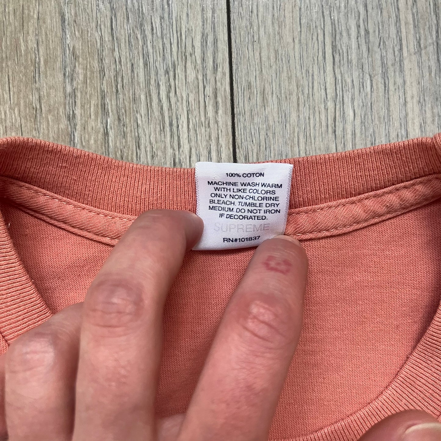 Supreme Cutouts FW18 Terra Cotta Tee is a terra-cotta colored T-shirt released on August 20, 2018, for the FW18 season. Made from 100% cotton, the front features a multicolor print composed of multiple cutouts of words and sentences. The design covers the front middle area of the shirt.