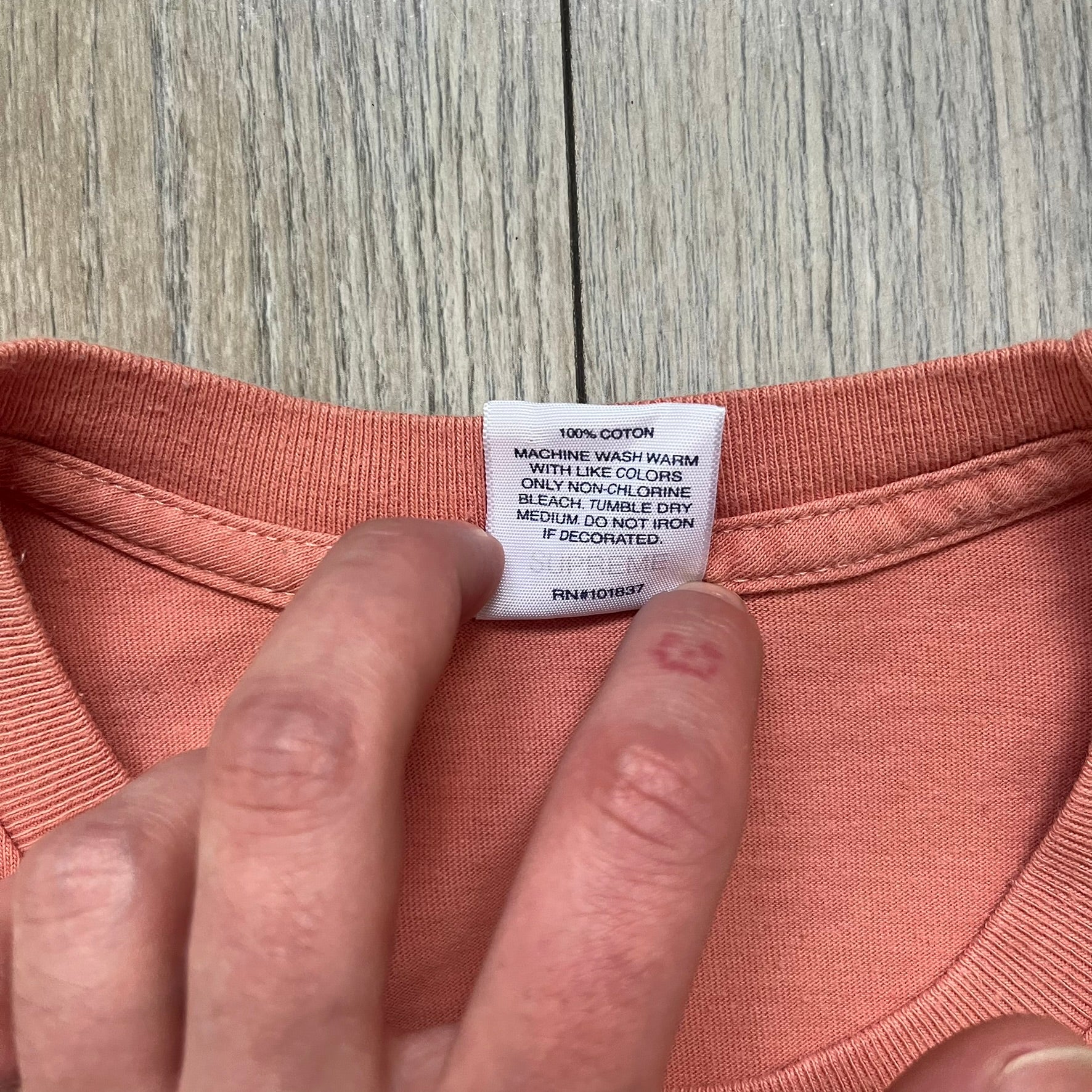 Supreme Cutouts FW18 Terra Cotta Tee is a terra-cotta colored T-shirt released on August 20, 2018, for the FW18 season. Made from 100% cotton, the front features a multicolor print composed of multiple cutouts of words and sentences. The design covers the front middle area of the shirt.