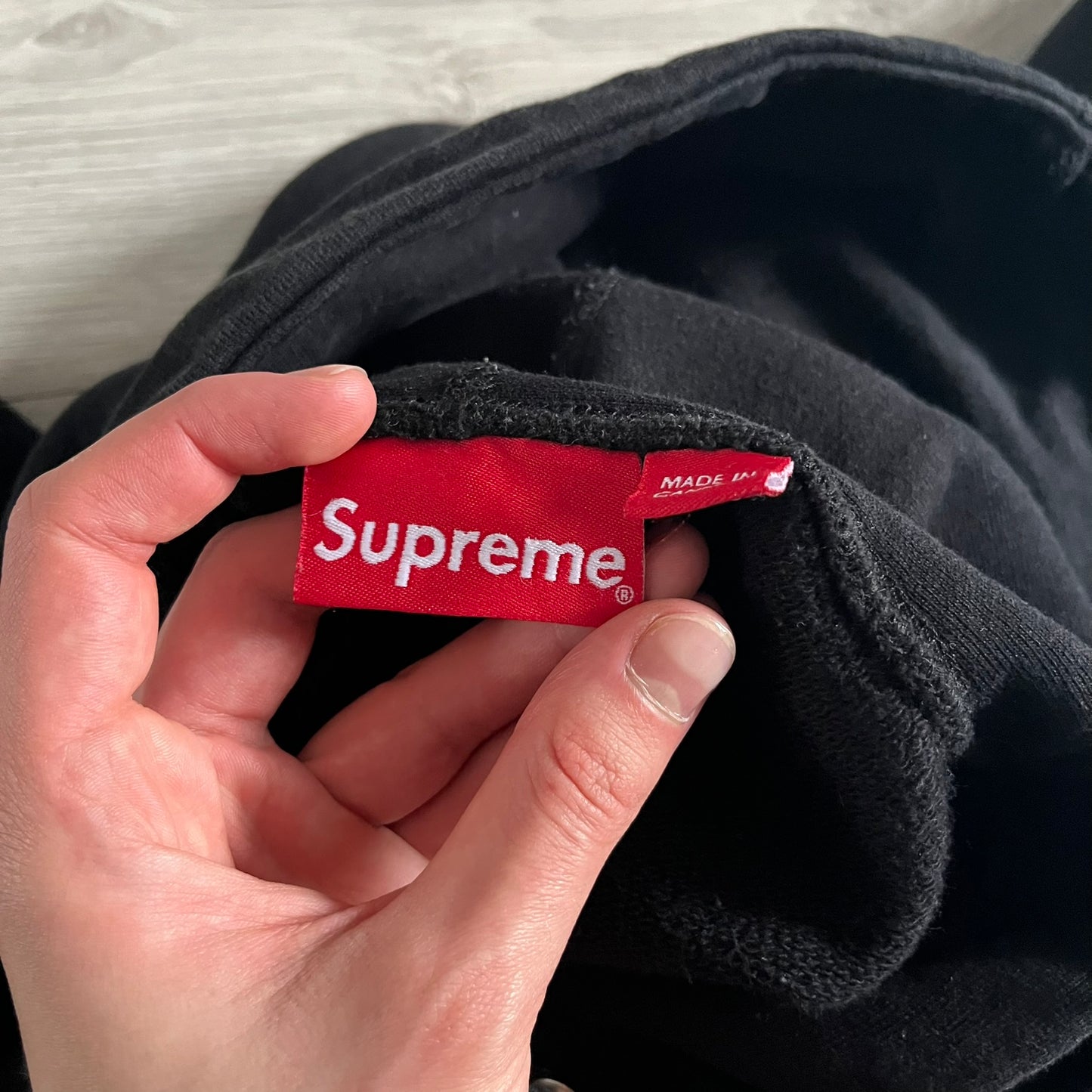 Released in Spring/Summer 2015, the Supreme Disrupt Hoodie in black features a minimalist front logo and a bold oversized back print. Made from 100% cotton, this piece delivers Supreme’s signature streetwear silhouette with durable rib-knit cuffs and hooded design.