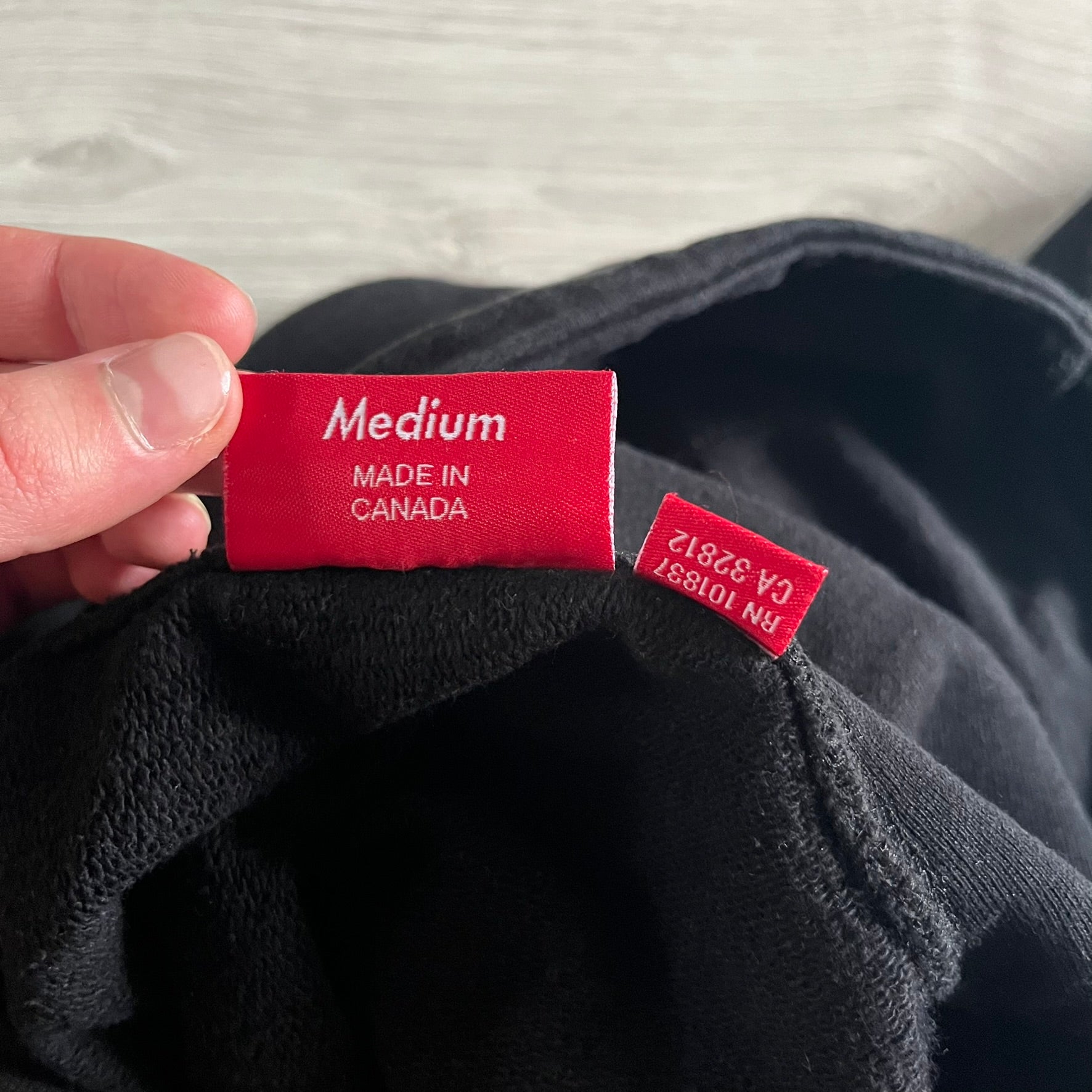 Released in Spring/Summer 2015, the Supreme Disrupt Hoodie in black features a minimalist front logo and a bold oversized back print. Made from 100% cotton, this piece delivers Supreme’s signature streetwear silhouette with durable rib-knit cuffs and hooded design.