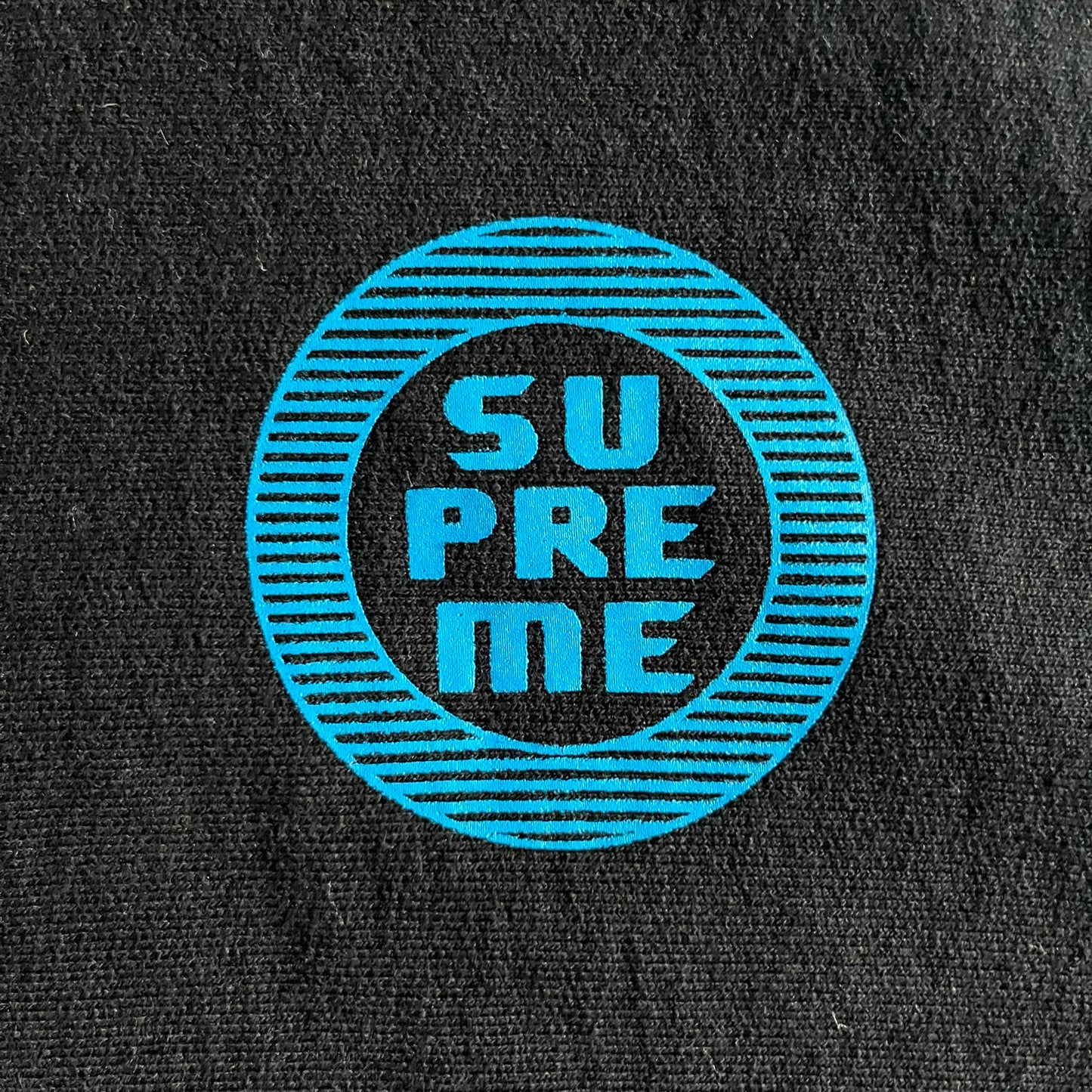 Released in Spring/Summer 2015, the Supreme Disrupt Hoodie in black features a minimalist front logo and a bold oversized back print. Made from 100% cotton, this piece delivers Supreme’s signature streetwear silhouette with durable rib-knit cuffs and hooded design.