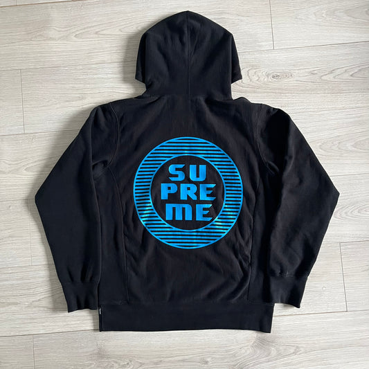 Released in Spring/Summer 2015, the Supreme Disrupt Hoodie in black features a minimalist front logo and a bold oversized back print. Made from 100% cotton, this piece delivers Supreme’s signature streetwear silhouette with durable rib-knit cuffs and hooded design.