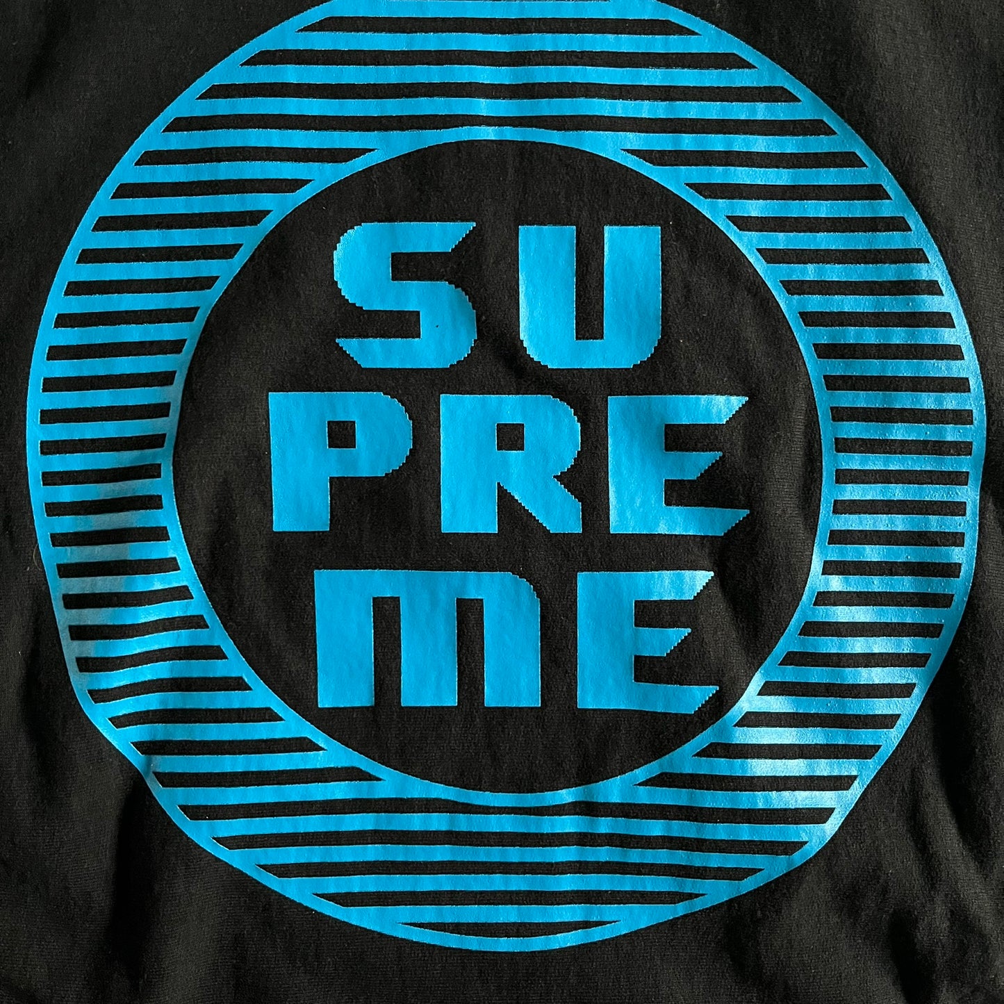 Released in Spring/Summer 2015, the Supreme Disrupt Hoodie in black features a minimalist front logo and a bold oversized back print. Made from 100% cotton, this piece delivers Supreme’s signature streetwear silhouette with durable rib-knit cuffs and hooded design.