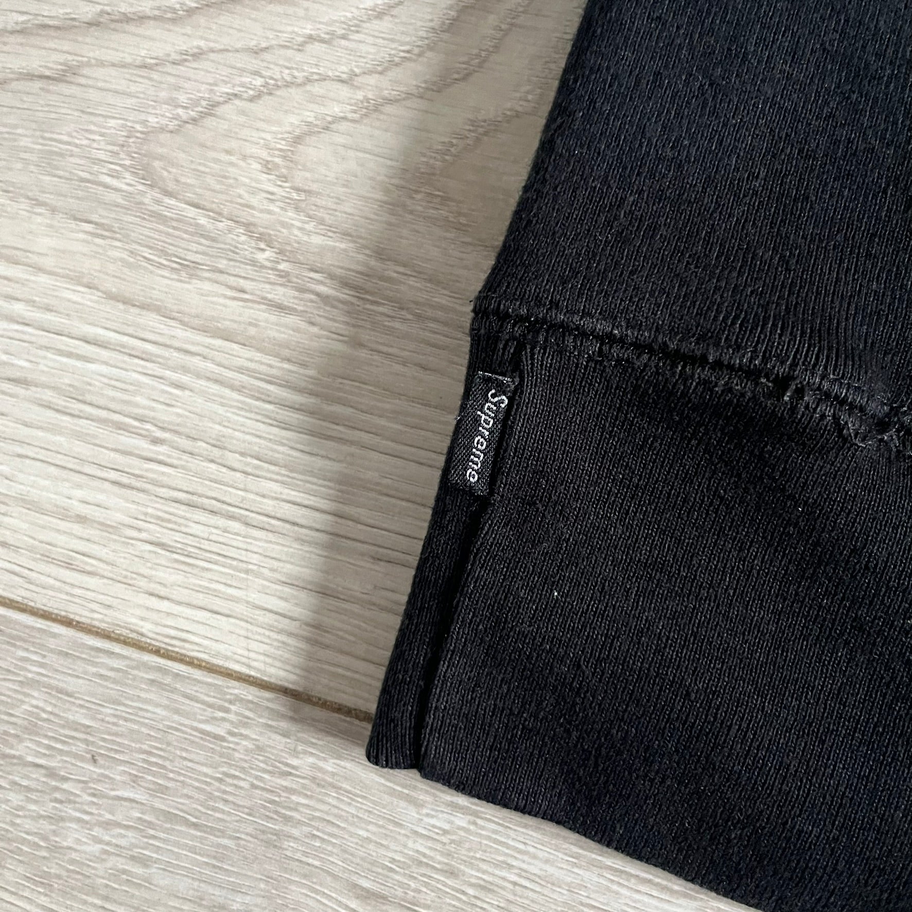 Released in Spring/Summer 2015, the Supreme Disrupt Hoodie in black features a minimalist front logo and a bold oversized back print. Made from 100% cotton, this piece delivers Supreme’s signature streetwear silhouette with durable rib-knit cuffs and hooded design.