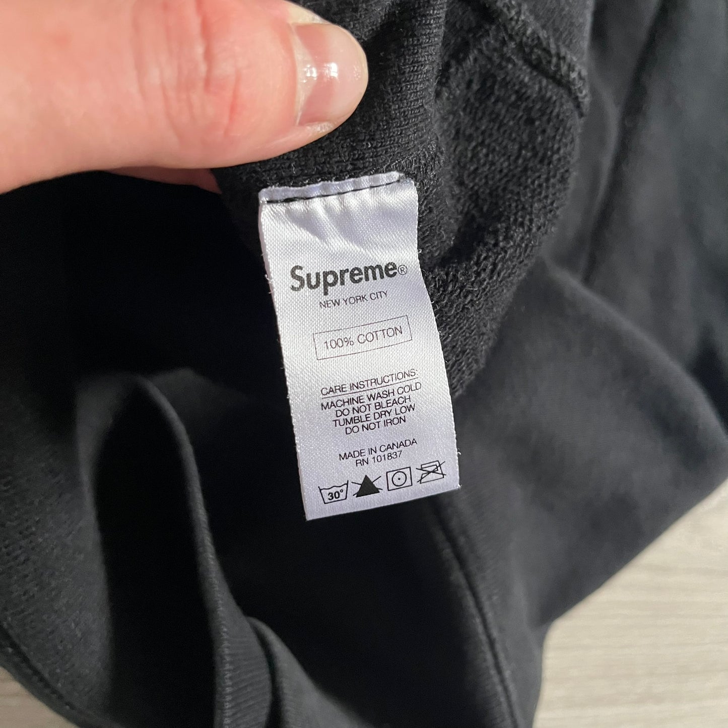Released in Spring/Summer 2015, the Supreme Disrupt Hoodie in black features a minimalist front logo and a bold oversized back print. Made from 100% cotton, this piece delivers Supreme’s signature streetwear silhouette with durable rib-knit cuffs and hooded design.