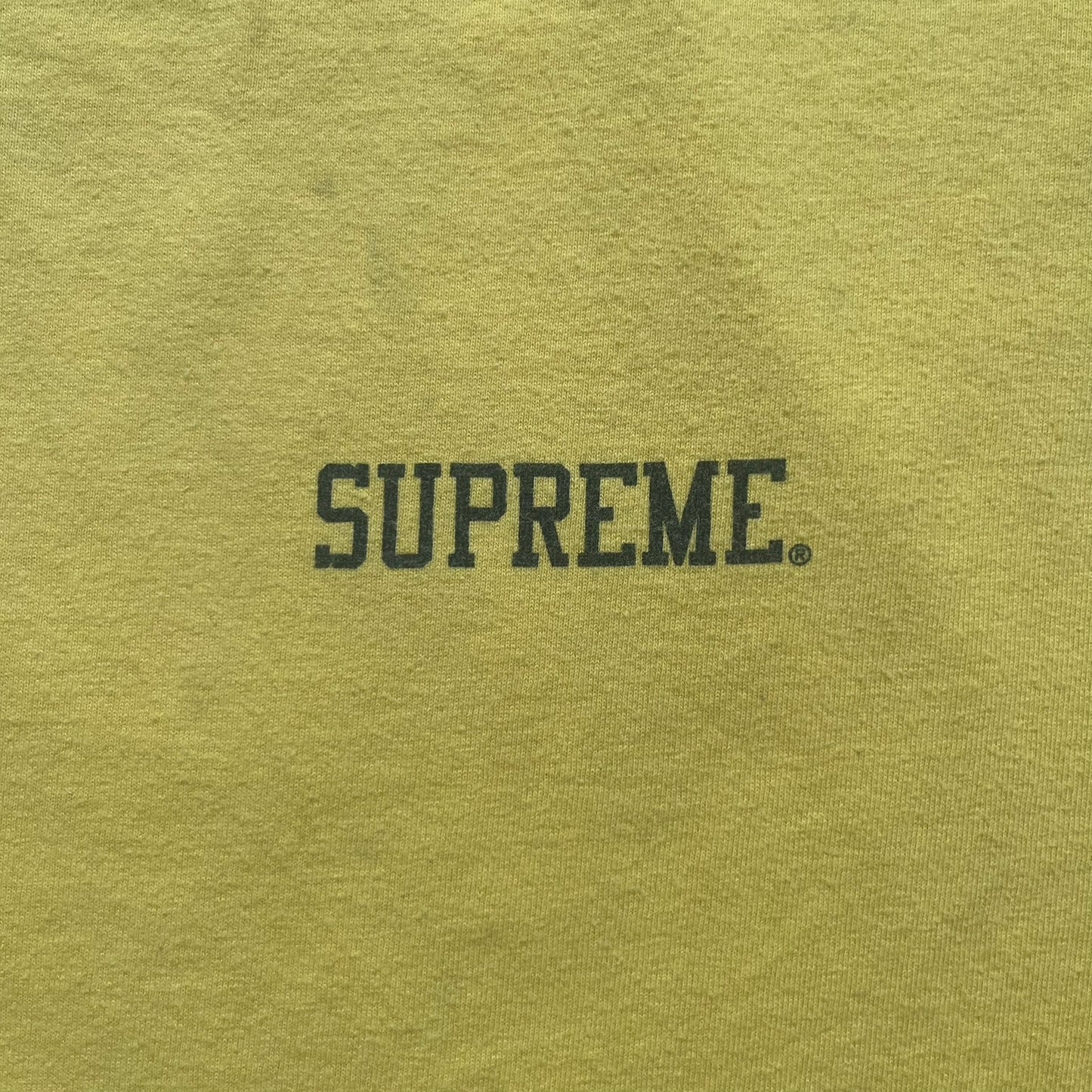 Supreme FW12 Stax Records Tee is a yellow T-shirt from the Fall/Winter 2012 collection. The front features small black Supreme text on the left chest. The back has a large Stax Records logo print with the blue and white hand graphic and red Stax text underneath. Concord Music Group licensing on the necktag.
