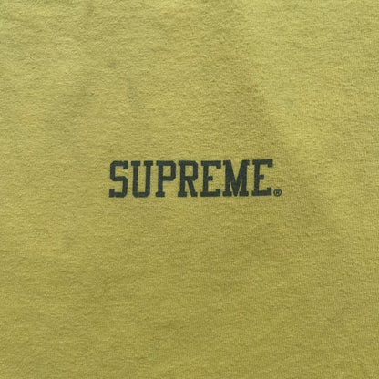 Supreme FW12 Stax Records Tee is a yellow T-shirt from the Fall/Winter 2012 collection. The front features small black Supreme text on the left chest. The back has a large Stax Records logo print with the blue and white hand graphic and red Stax text underneath. Concord Music Group licensing on the necktag.