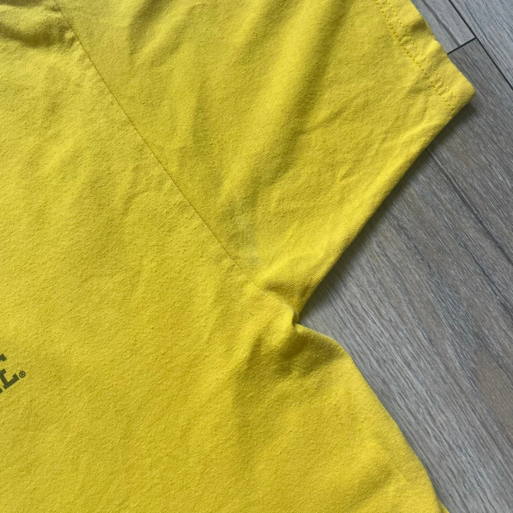 Supreme FW12 Stax Records Tee is a yellow T-shirt from the Fall/Winter 2012 collection. The front features small black Supreme text on the left chest. The back has a large Stax Records logo print with the blue and white hand graphic and red Stax text underneath. Concord Music Group licensing on the necktag.