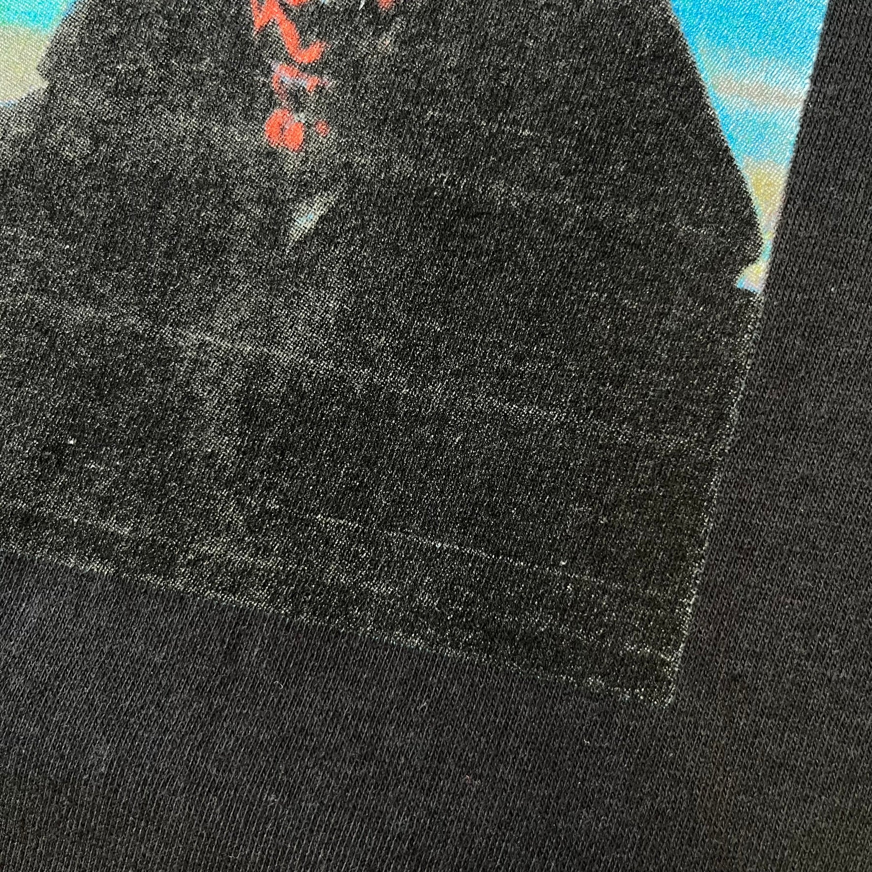 Supreme FW26 Darth Maul Sith Black Tee features a black 100% cotton T-shirt with a photo graphic of Darth Maul on a blue background. A white Supreme logo is printed above the graphic. Features a licensed Star Wars neck tag and is made in Honduras.
