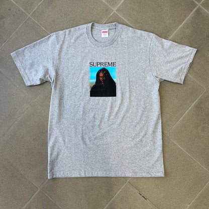 Supreme FW26 Darth Maul Sith Gray Tee features a black 90% cotton and 10% polyester T-shirt with a photo graphic of Darth Maul on a blue background. A white Supreme logo is printed above the graphic. Features a licensed Star Wars neck tag and is made in Honduras.