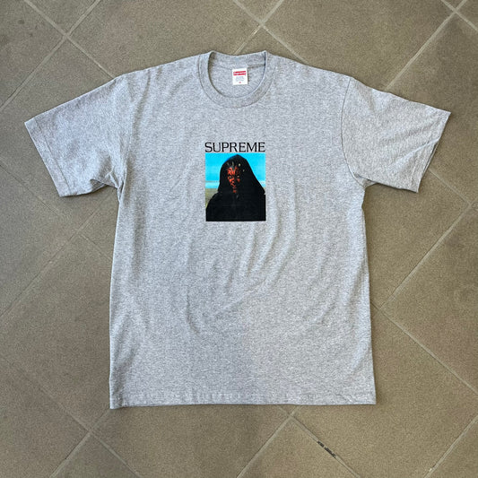 Supreme FW26 Darth Maul Sith Gray Tee features a black 90% cotton and 10% polyester T-shirt with a photo graphic of Darth Maul on a blue background. A white Supreme logo is printed above the graphic. Features a licensed Star Wars neck tag and is made in Honduras.