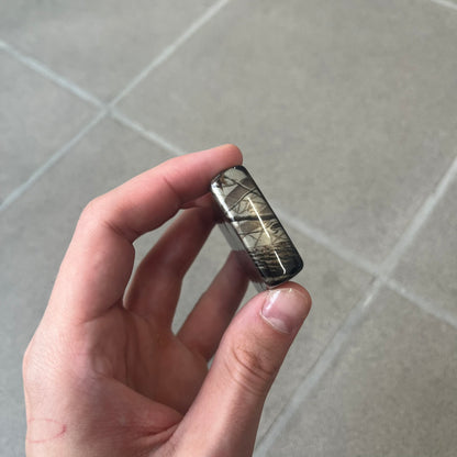 Supreme FW26 RealTree Camo Logo Zippo Lighter is an original Zippo featuring a full RealTree camo graphic with the Supreme box logo on the front. It comes with the original Zippo box and has never been filled.