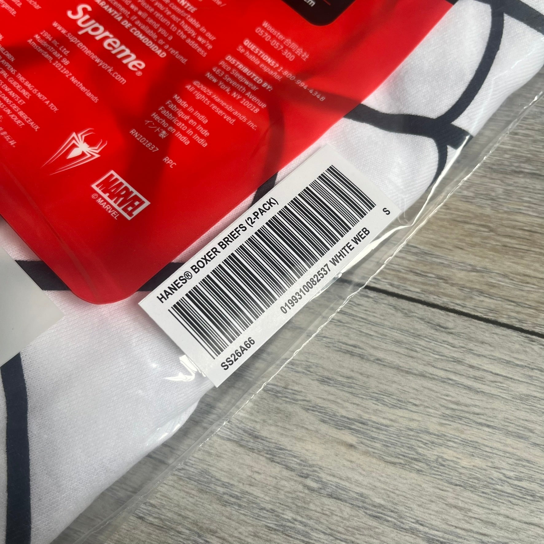 Supreme Hanes SS26 Spider-Man White Boxer Briefs are made of cotton with a stretch fit. Features a red elastic waistband with white Supreme logo text and an all-over black web print. Classic Hanes base model a Spider-Man twist.