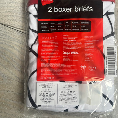 Supreme Hanes SS26 Spider-Man White Boxer Briefs are made of cotton with a stretch fit. Features a red elastic waistband with white Supreme logo text and an all-over black web print. Classic Hanes base model a Spider-Man twist.