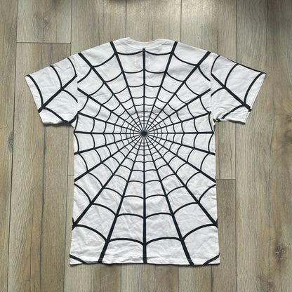 Supreme Hanes SS26 Spider-Man White Tagless Tee is a white all-cotton crewneck T-shirt from the Spring/Summer 2026 collection, produced on a Hanes tagless blank. The shirt features an all-over black web print covering the front, back, and sleeves, with a small red Supreme stamp logo printed near the bottom corner.