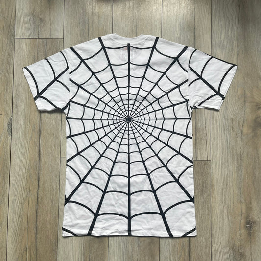 Supreme Hanes SS26 Spider-Man White Tagless Tee is a white all-cotton crewneck T-shirt from the Spring/Summer 2026 collection, produced on a Hanes tagless blank. The shirt features an all-over black web print covering the front, back, and sleeves, with a small red Supreme stamp logo printed near the bottom corner.