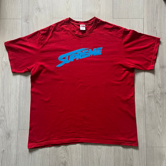 Supreme Mont Blanc Red Tee from the FW23 collection, released on October 5th, 2023 (Week 7). Made from 100% cotton, this red tee features a bold blue Supreme logo printed across the chest, with a clean monochrome back. A classic Supreme piece with a simple yet striking color contrast and casual silhouette.