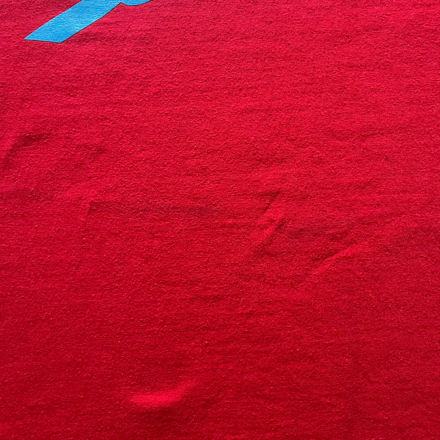 Supreme Mont Blanc Red Tee from the FW23 collection, released on October 5th, 2023 (Week 7). Made from 100% cotton, this red tee features a bold blue Supreme logo printed across the chest, with a clean monochrome back. A classic Supreme piece with a simple yet striking color contrast and casual silhouette.