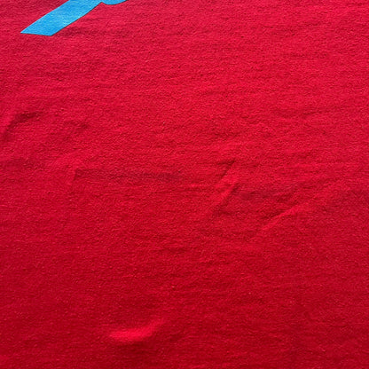 Supreme Mont Blanc Red Tee from the FW23 collection, released on October 5th, 2023 (Week 7). Made from 100% cotton, this red tee features a bold blue Supreme logo printed across the chest, with a clean monochrome back. A classic Supreme piece with a simple yet striking color contrast and casual silhouette.