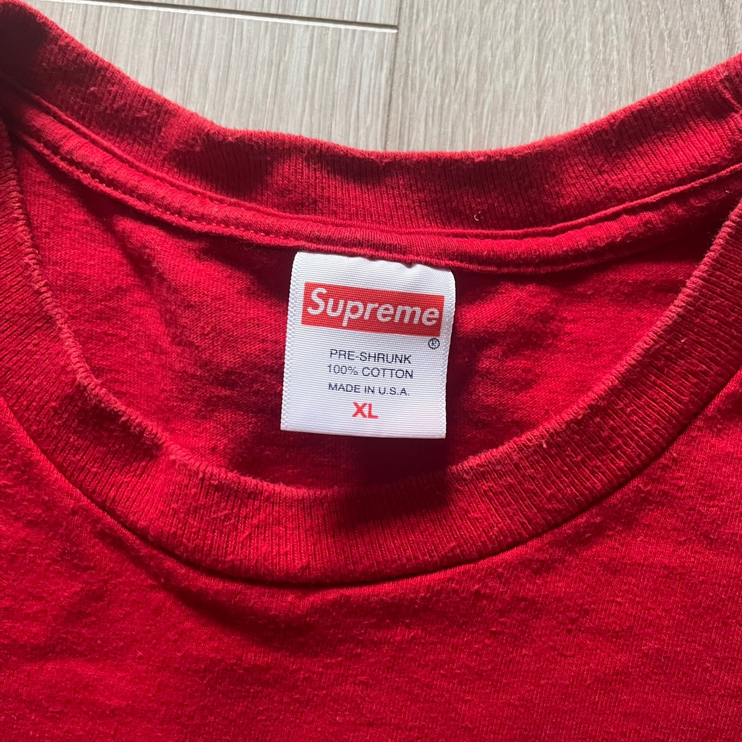 Supreme Mont Blanc Red Tee from the FW23 collection, released on October 5th, 2023 (Week 7). Made from 100% cotton, this red tee features a bold blue Supreme logo printed across the chest, with a clean monochrome back. A classic Supreme piece with a simple yet striking color contrast and casual silhouette.
