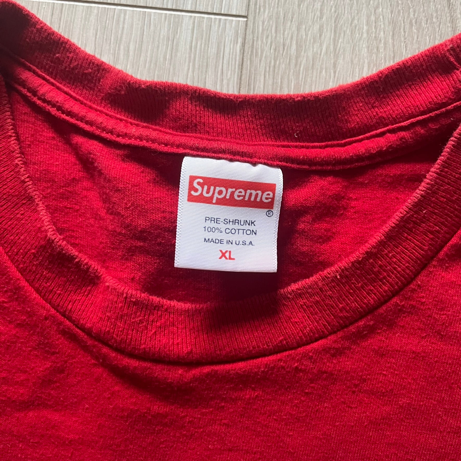 Supreme Mont Blanc Red Tee from the FW23 collection, released on October 5th, 2023 (Week 7). Made from 100% cotton, this red tee features a bold blue Supreme logo printed across the chest, with a clean monochrome back. A classic Supreme piece with a simple yet striking color contrast and casual silhouette.