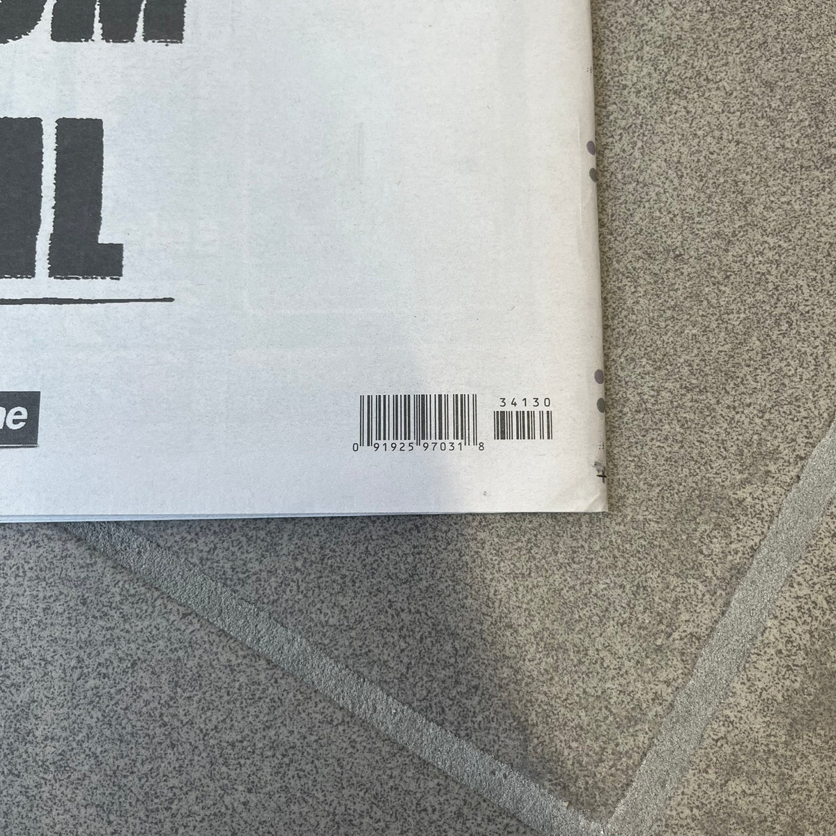 Supreme New York Post Newspaper “Metro Edition” from Fall/Winter 2026, released on August 17th, 2026. Features the features a religious statue with iconic Supreme box logo printed on it. On the back there's a "Deliver US From Evil". Includes the full original newspaper, with only the cover designed by Supreme.