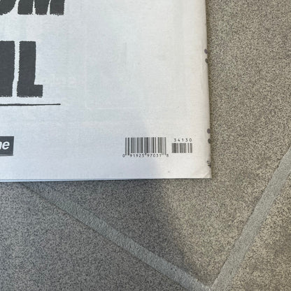 Supreme New York Post Newspaper “Metro Edition” from Fall/Winter 2026, released on August 17th, 2026. Features the features a religious statue with iconic Supreme box logo printed on it. On the back there's a "Deliver US From Evil". Includes the full original newspaper, with only the cover designed by Supreme.
