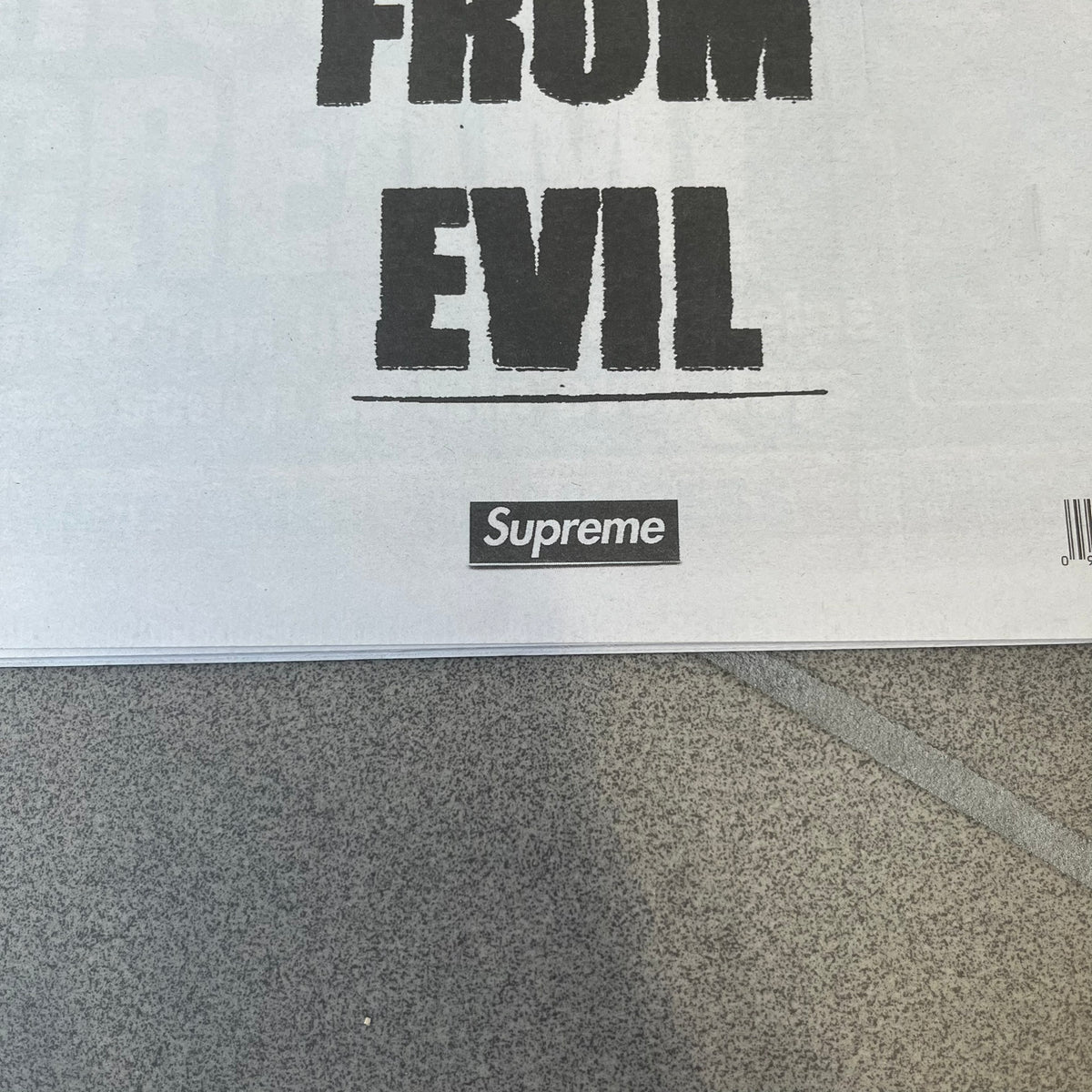Supreme New York Post Newspaper “Metro Edition” from Fall/Winter 2026, released on August 17th, 2026. Features the features a religious statue with iconic Supreme box logo printed on it. On the back there's a "Deliver US From Evil". Includes the full original newspaper, with only the cover designed by Supreme.