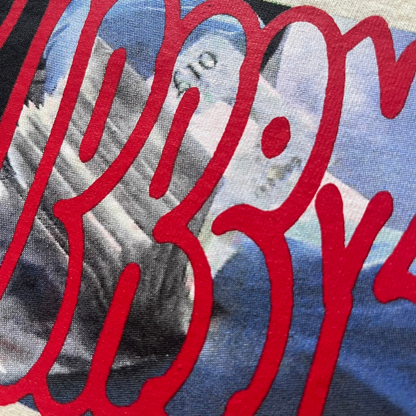 Natural Supreme tee from the FW23 season showcasing the “Payment” design. The front graphic depicts a pile of GBP banknotes with a large red graffiti-style Supreme tag layered across. A clean and minimalistic yet striking piece from the collection.