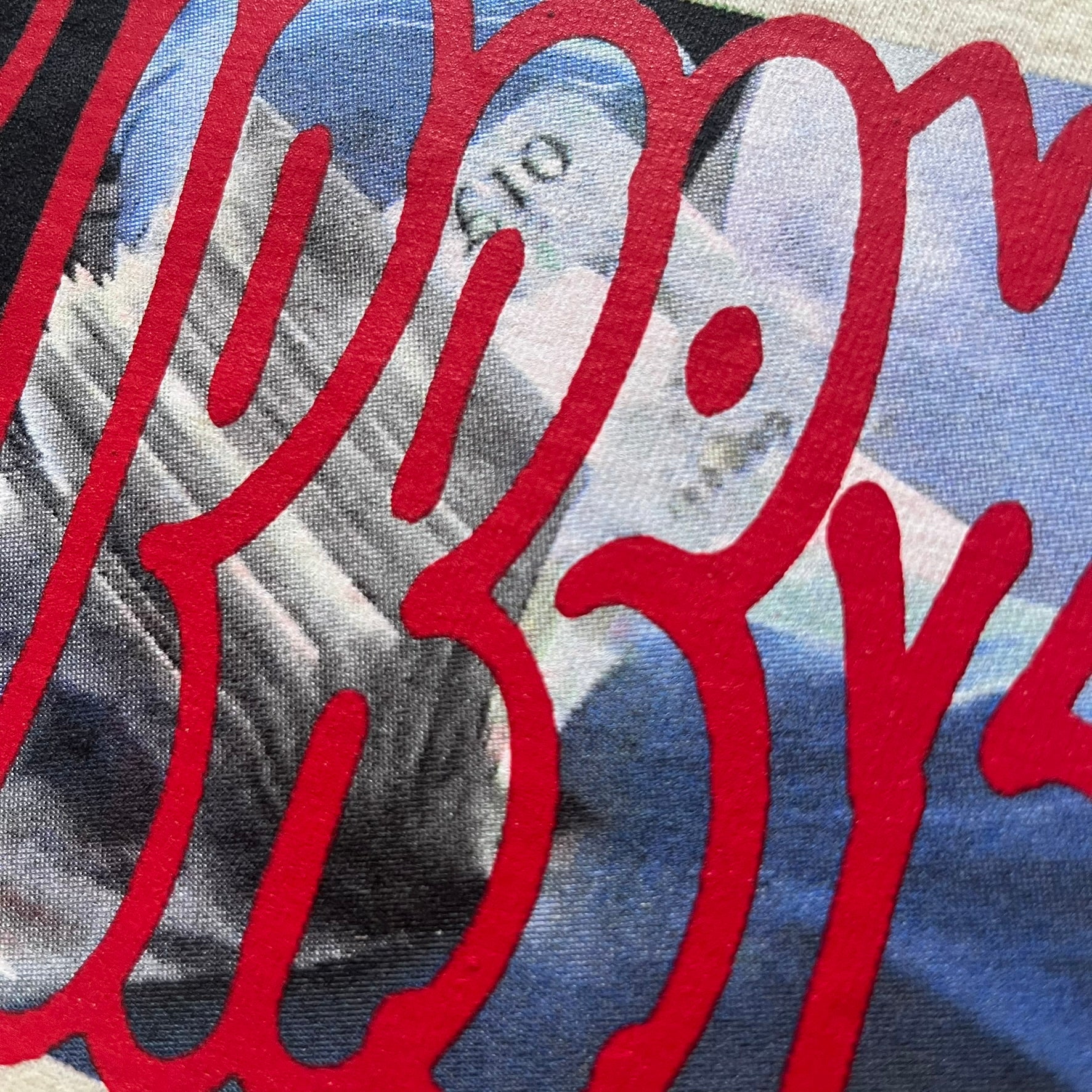 Natural Supreme tee from the FW23 season showcasing the “Payment” design. The front graphic depicts a pile of GBP banknotes with a large red graffiti-style Supreme tag layered across. A clean and minimalistic yet striking piece from the collection.