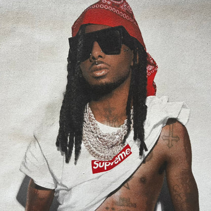 Supreme Playboi Carti photo tee in Heather Gray from the FW25 collection, featuring a large front print of the influential rapper. Crafted from soft cotton, it merges Supreme’s iconic photo tee format with Carti’s distinct cultural presence.
